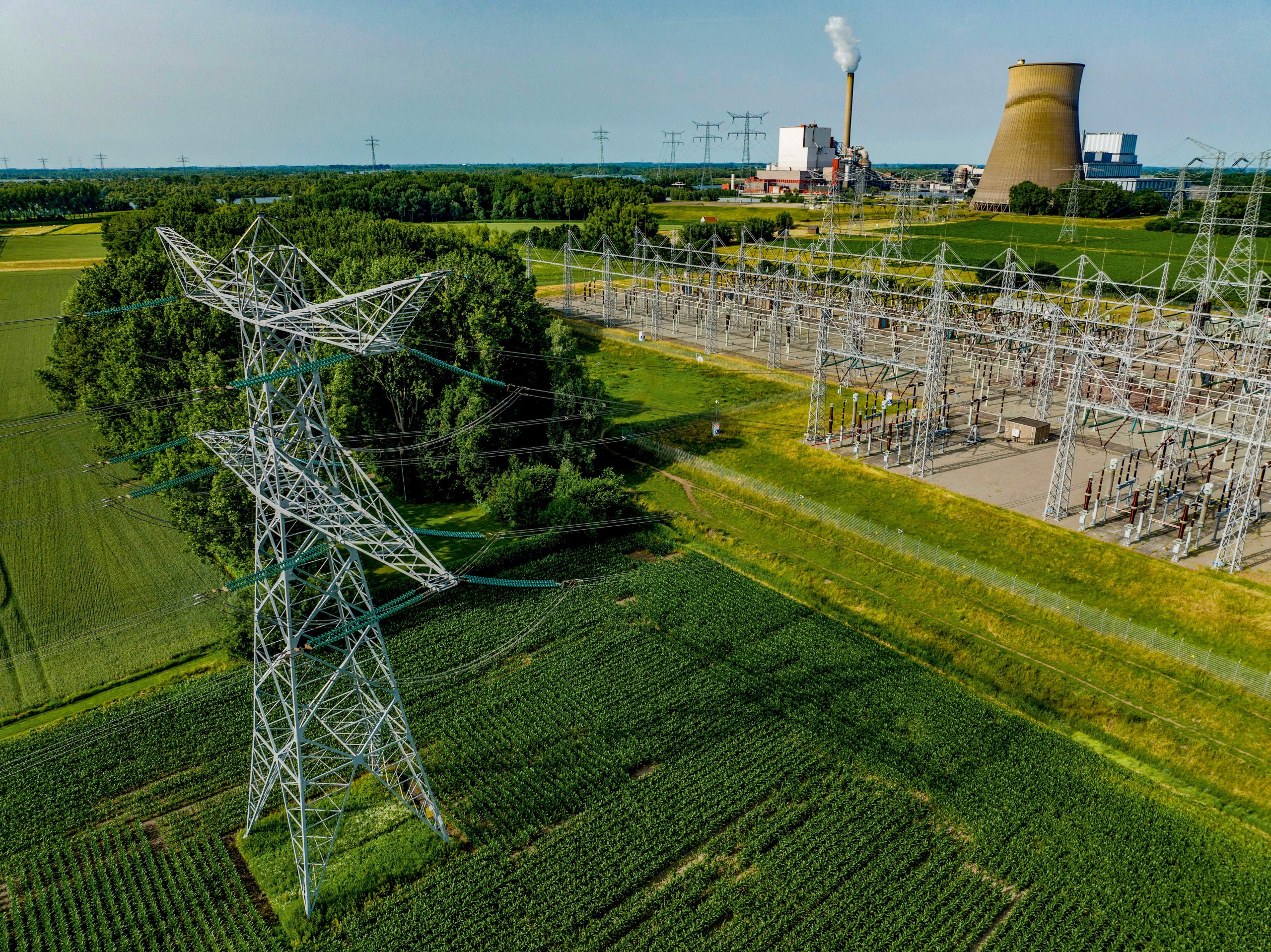 aerial-view-of-power-lines-leading-to-an-industria-2024-03-01-02-47-28-utc