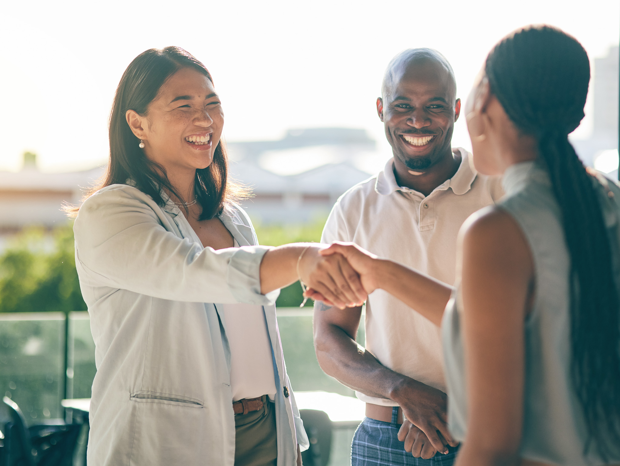 Business people, handshake and happy in collaboration, deal or a