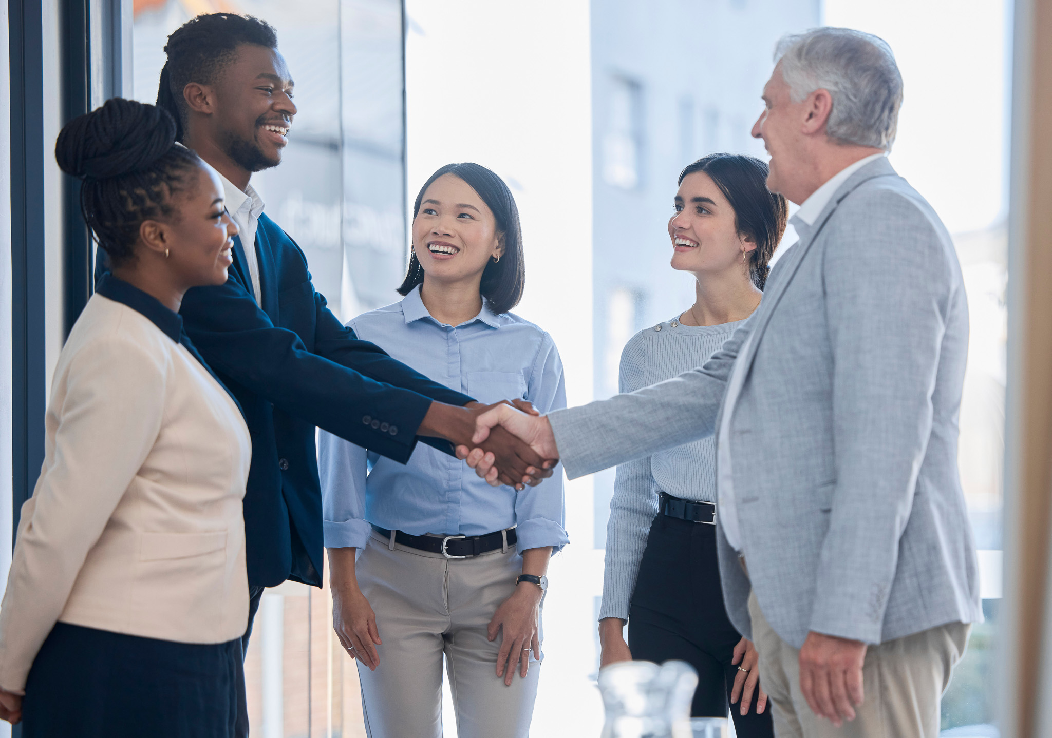 Hand shake, acquisition and business people happy for investment